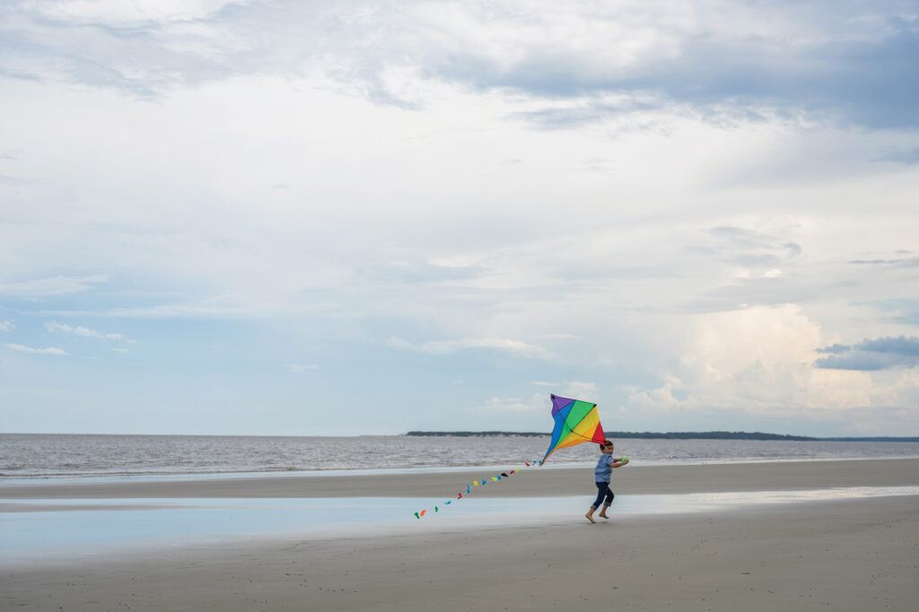 Flying a kite on the beach